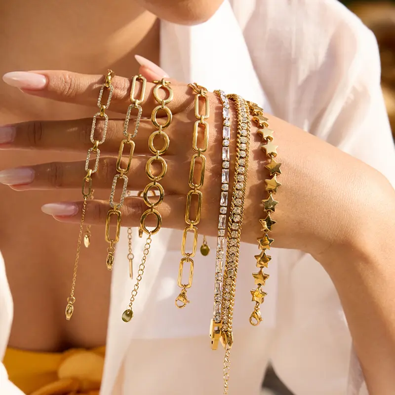 Gold chain bracelets with charms – trendy layered fashion jewelry